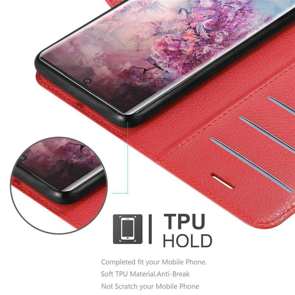 Ein Telefon in einer roten Hülle. Das Telefon ist schwarz, die Hülle ist rot. Die Hülle hat Kartenfächer.