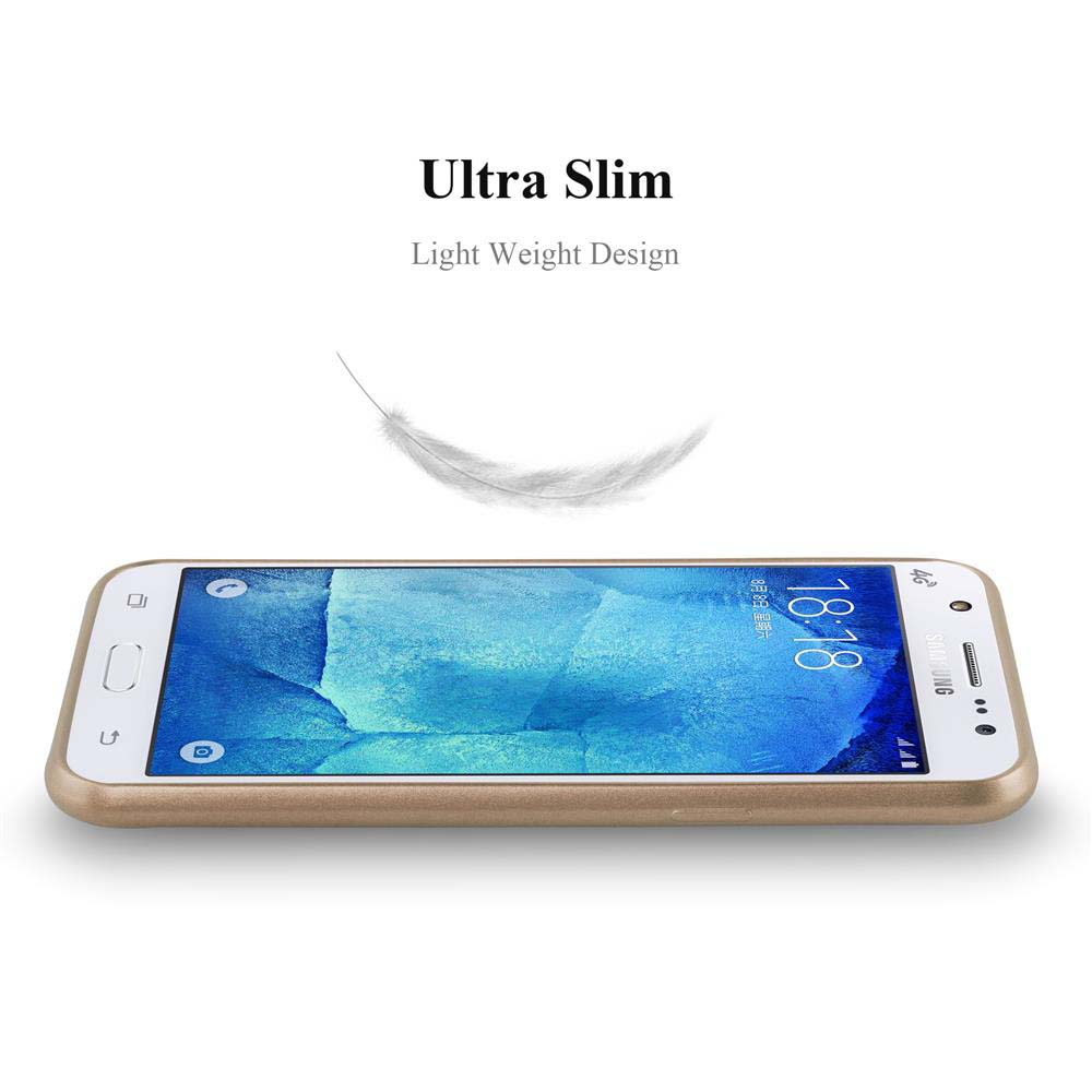 Ein Telefon liegt auf einer weißen Oberfläche, mit einer Feder darüber, das Telefon hat einen goldenen Rand.