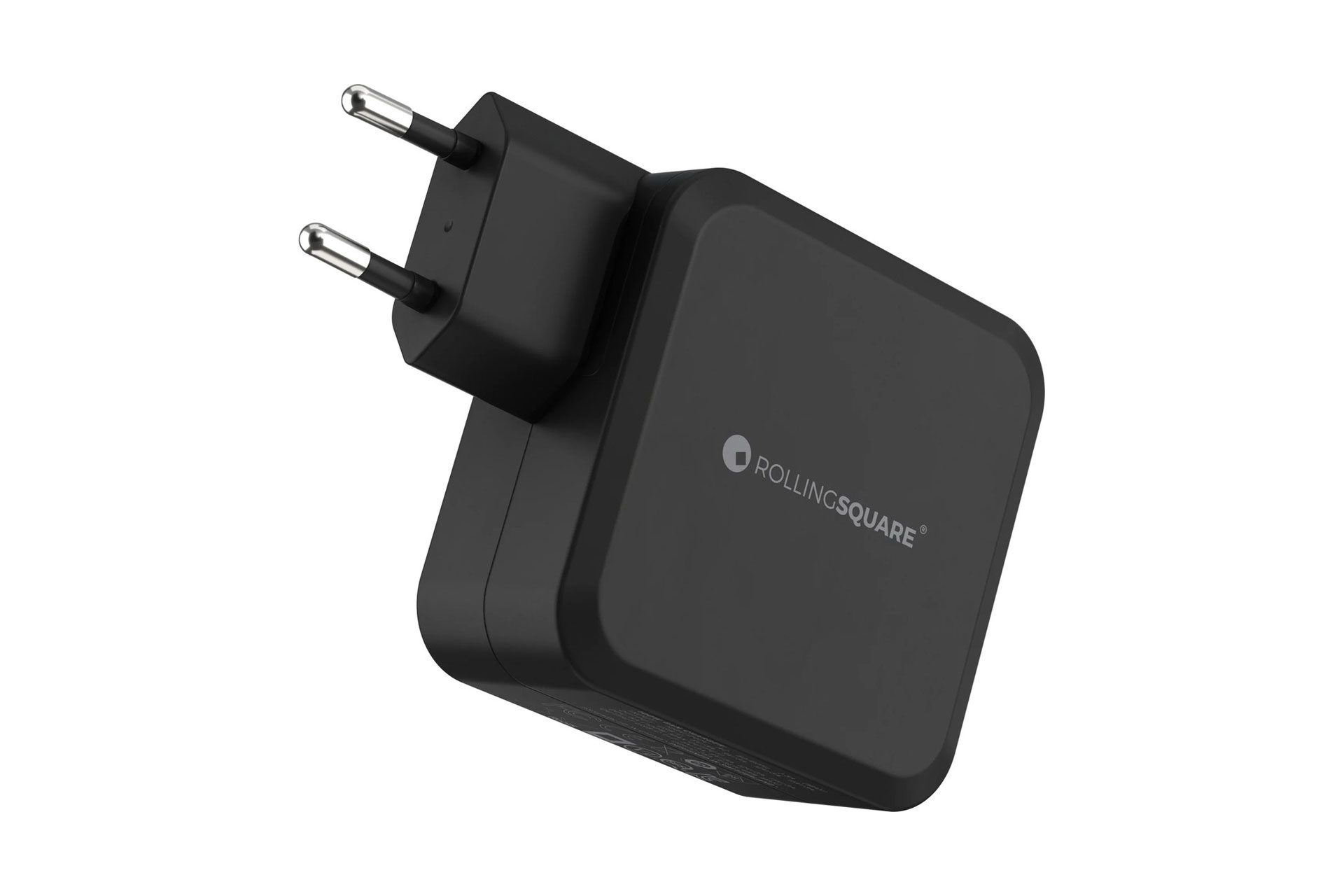 Een zwarte telefoonlader met een stekker met twee pinnen. Er staat 'ROLLINGSQUARE' op de voorkant.