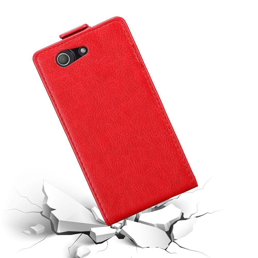 Funda de teléfono roja cayendo con suelo roto debajo.