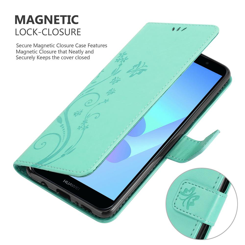 Custodia verde per telefono aperta con un telefono all'interno. La custodia ha un motivo floreale. Testo chiusura magnetica.