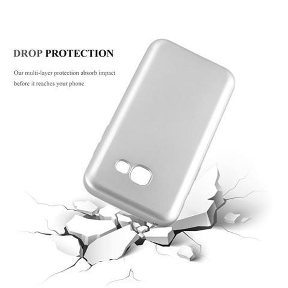 Una funda plateada para teléfono en suelo agrietado. Texto: Protección contra caídas. La funda parece intacta.