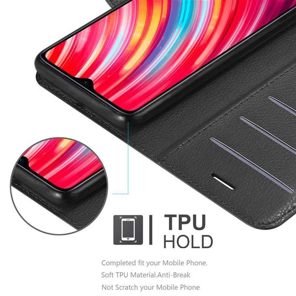 Telefono all'interno di una custodia nera. Testo: TPU HOLD. Si adatta perfettamente, è anti-rottura, non graffia.