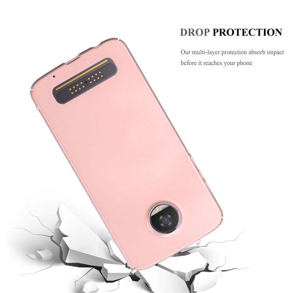 Custodia rosa per telefono che cade, con un telefono all'interno. Testo 'PROTEZIONE CADUTA'. Suolo rotto sotto.