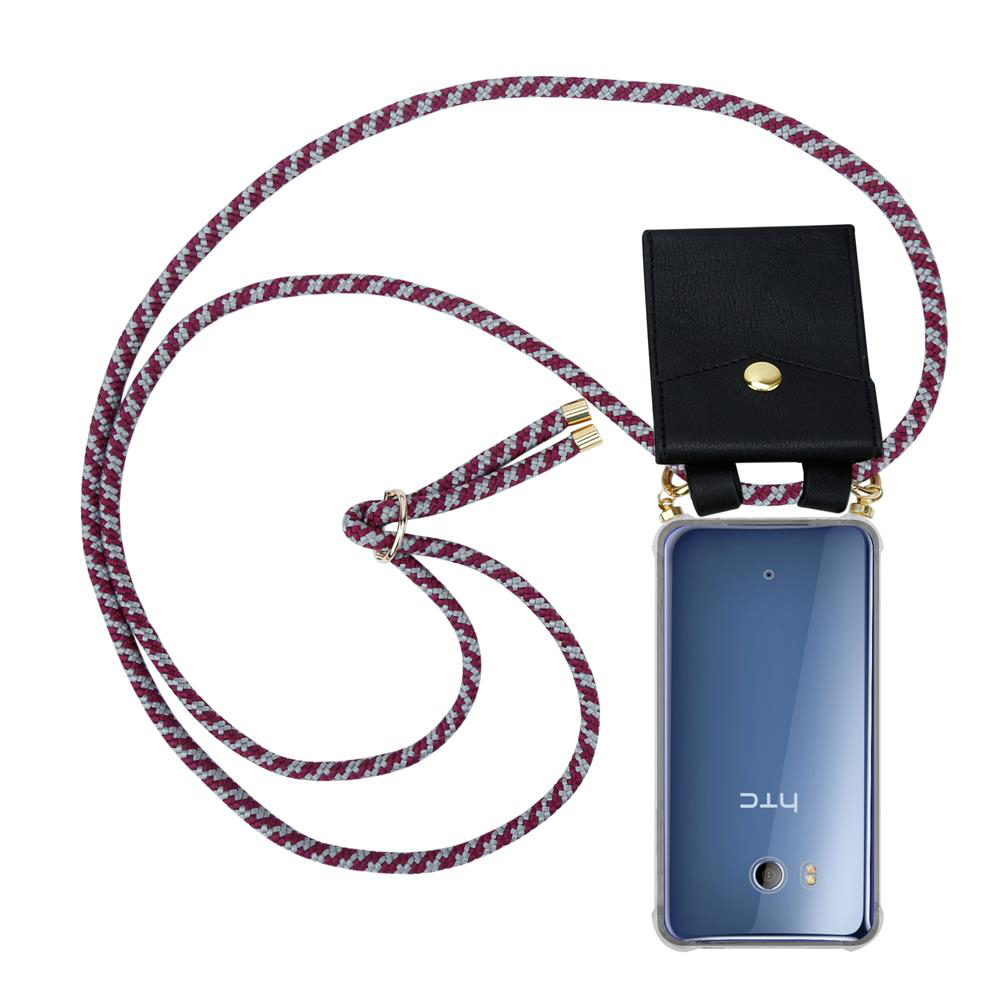 Ein HTC-Telefon mit transparentem Gehäuse hängt an einer lila-weißen Kordel.