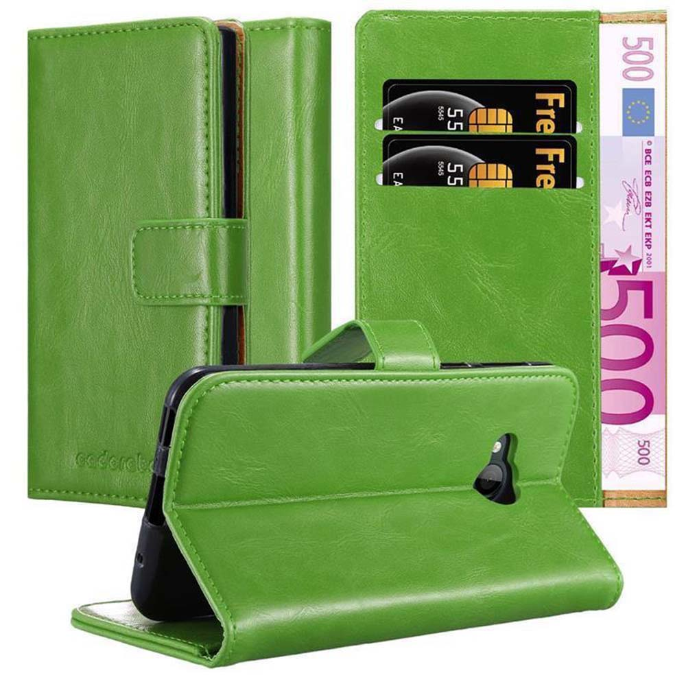 Portafoglio verde per telefono con denaro e carte di credito. Un portafoglio aperto, che mostra il contenuto.