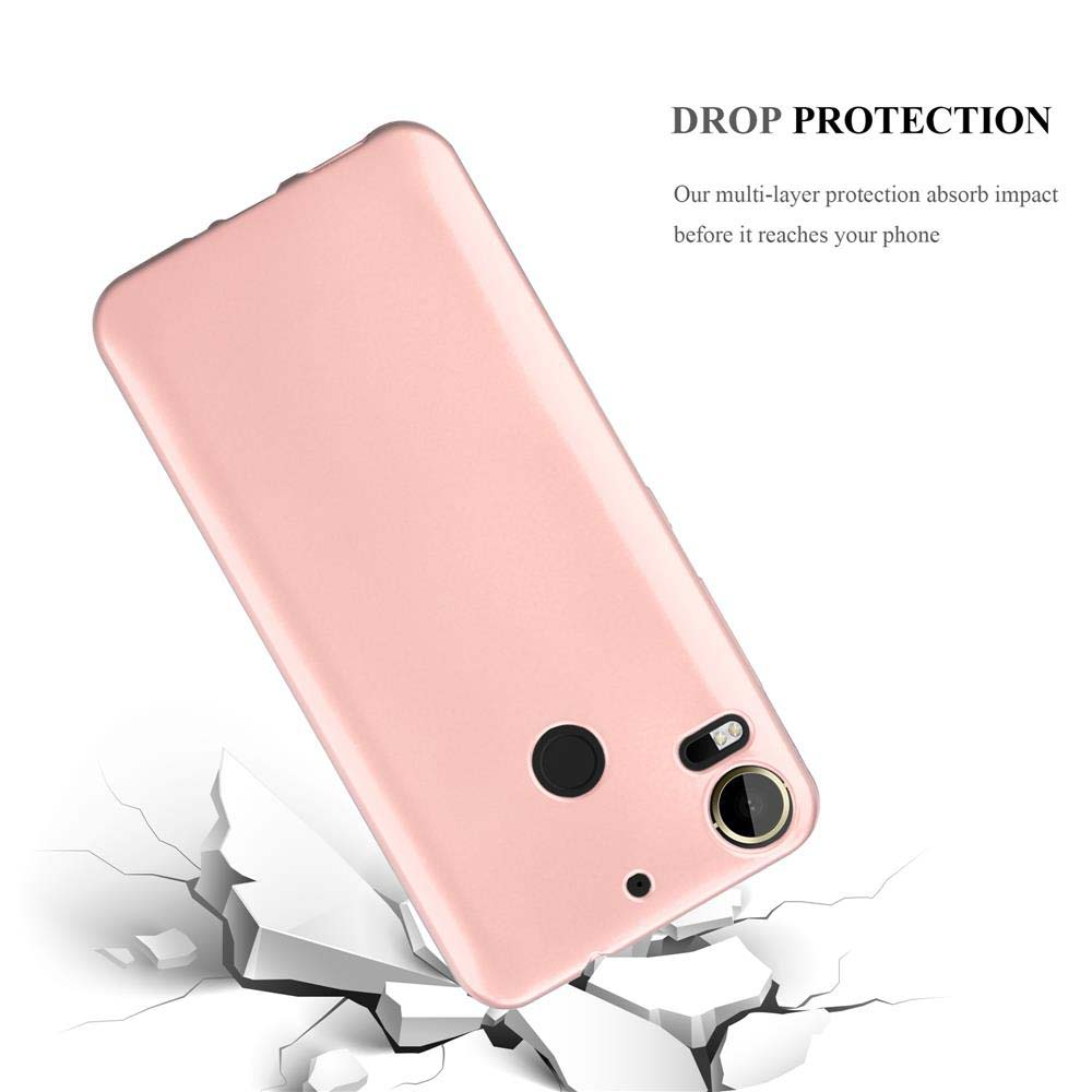 Una custodia rosa con un telefono all'interno, appoggiata su una superficie che si rompe. Sfondo bianco.