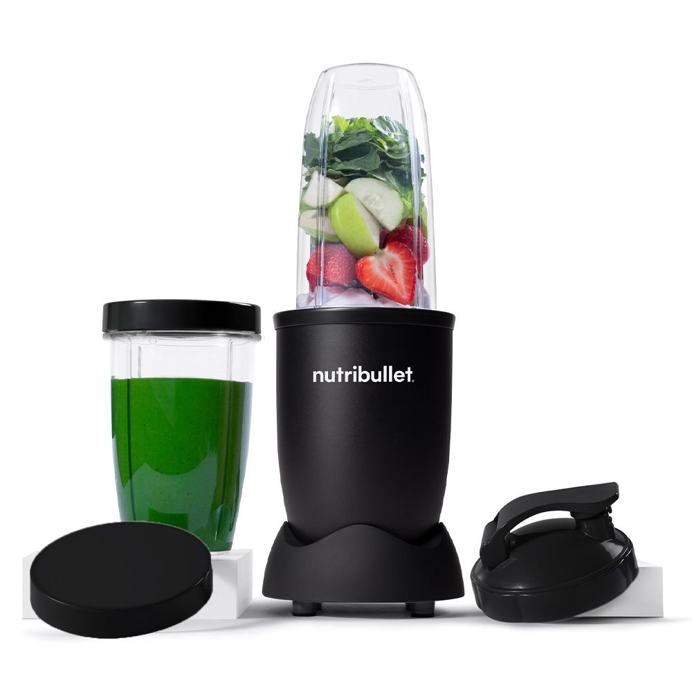 Black Nutribullet blender with a container filled with fruit and vegetables.