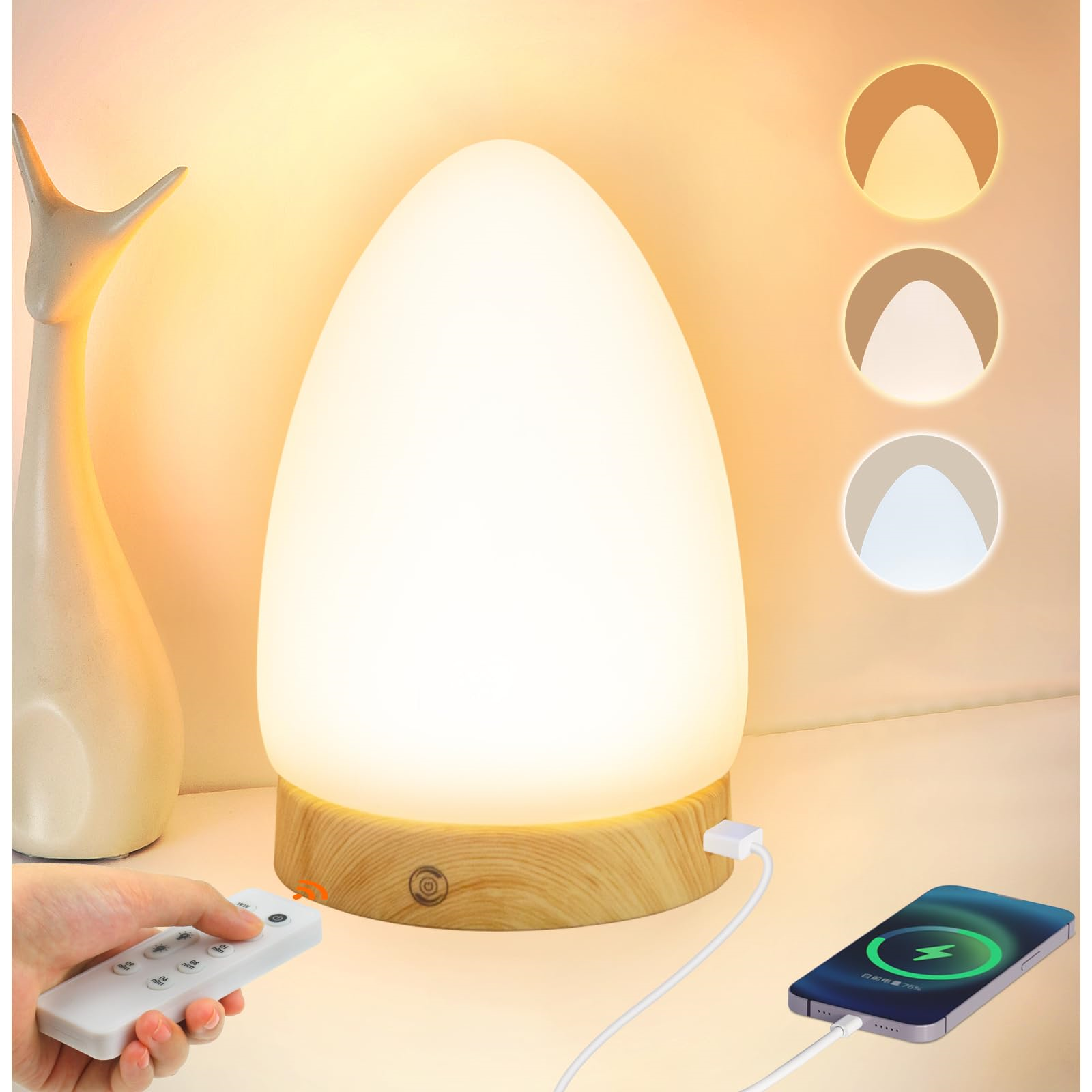 Weiße eiförmige Lampe auf Holzsockel, mit Fernbedienung und ladendem Telefon.