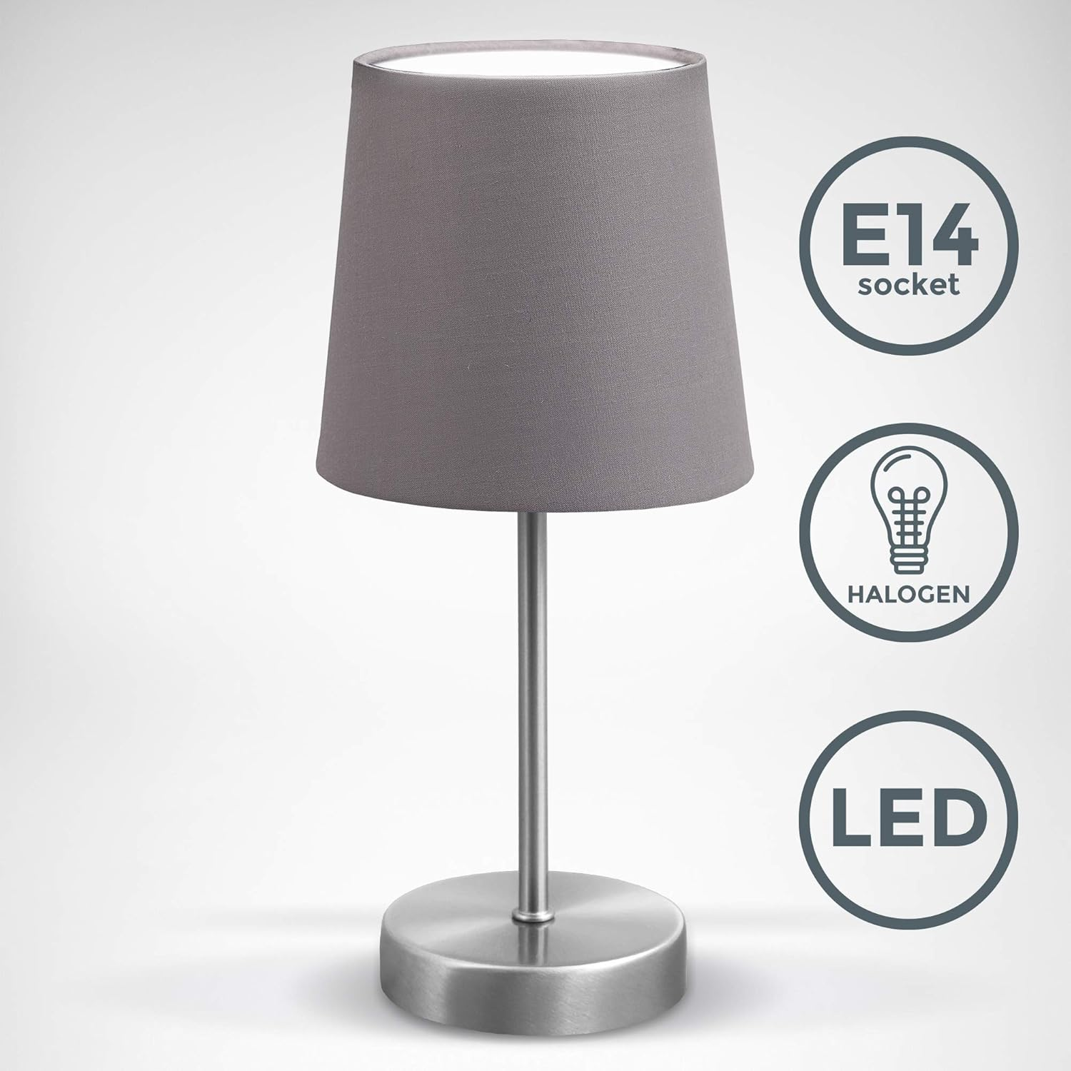 Graue Tischlampe mit grauem Lampenschirm und silbernem Sockel auf weißem Hintergrund mit Text.