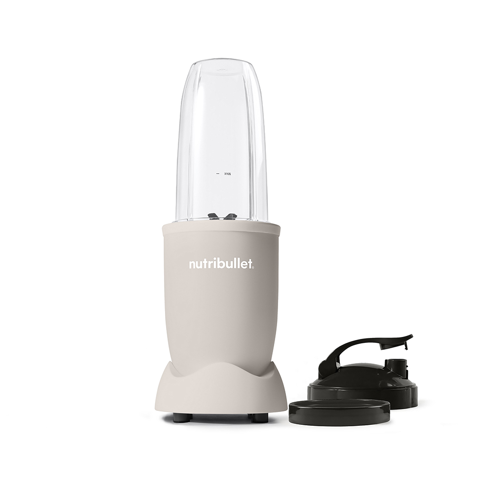 Nutribullet blender with accessories. Beige base, clear container, and a black lid.