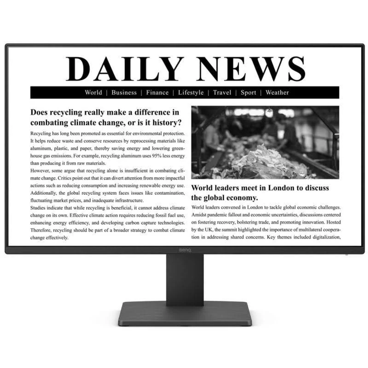 Monitor komputera wyświetla Daily News. Tekst omawia recykling, zmiany klimatyczne i światowych liderów.