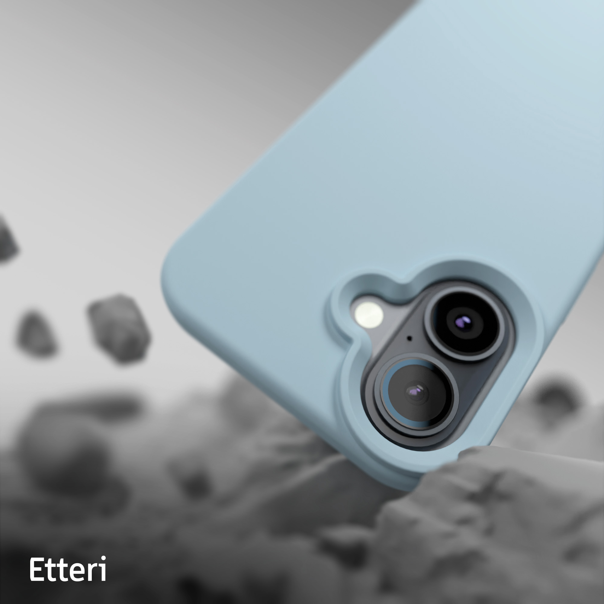 Niebieskie etui na telefon z wycięciem na aparat i szarym tłem ze skałami i tekstem 'Etteri'.