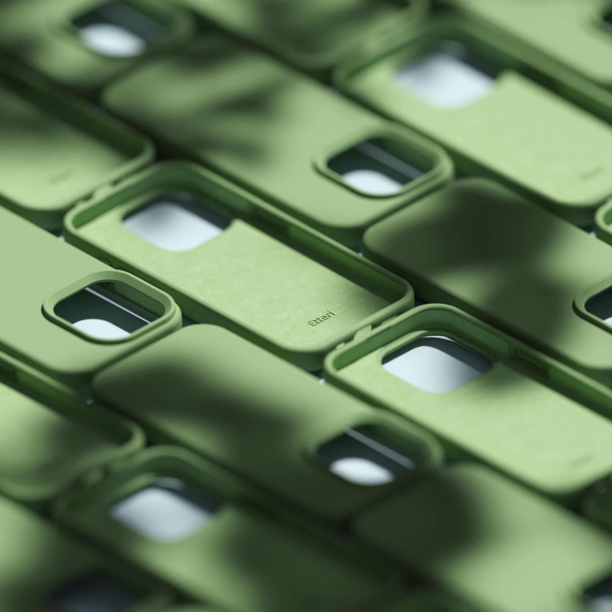 Zielone etui na telefony ułożone w rzędach, zbliżenie, pokazujące wnętrze.