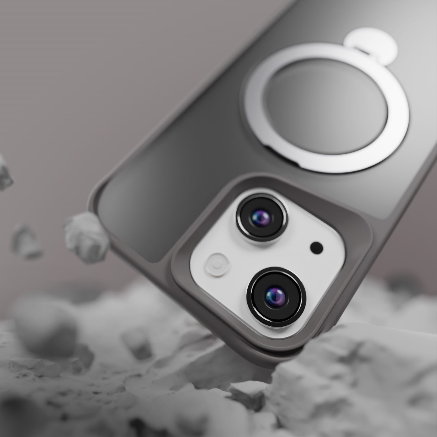 Custodia per telefono con anello, che cade su uno sfondo grigio con rocce.