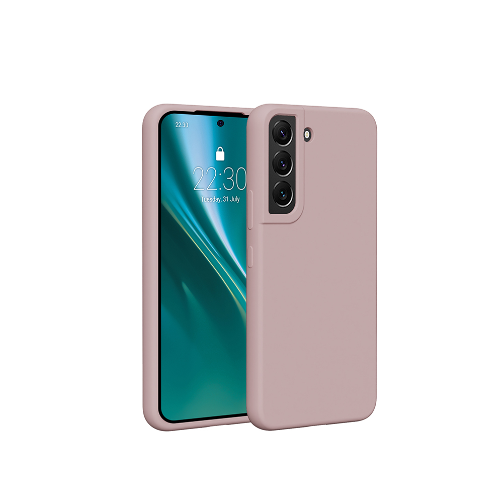 Różowe etui na telefon i telefon. Telefon pokazuje wyświetlacz z godziną i datą.