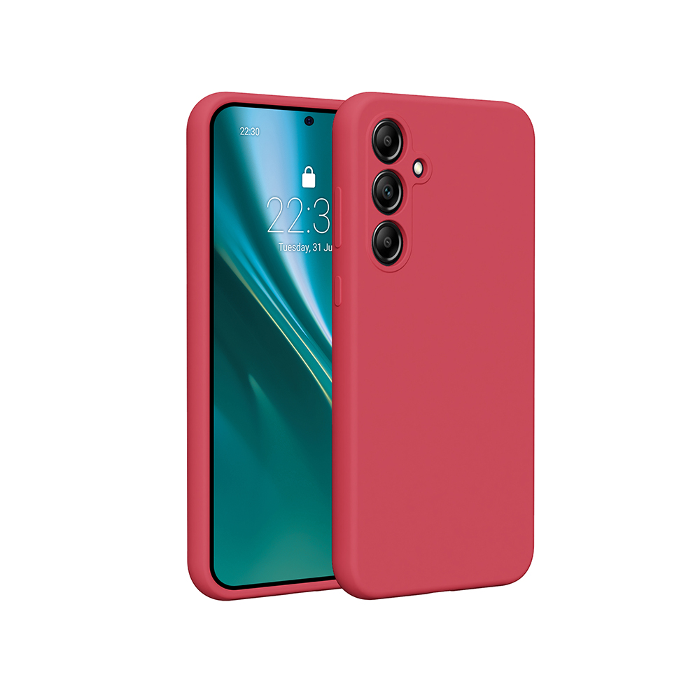 Czerwony telefon w czerwonym etui, ekran pokazuje godzinę i datę. Tło jest rozmyte zielone.