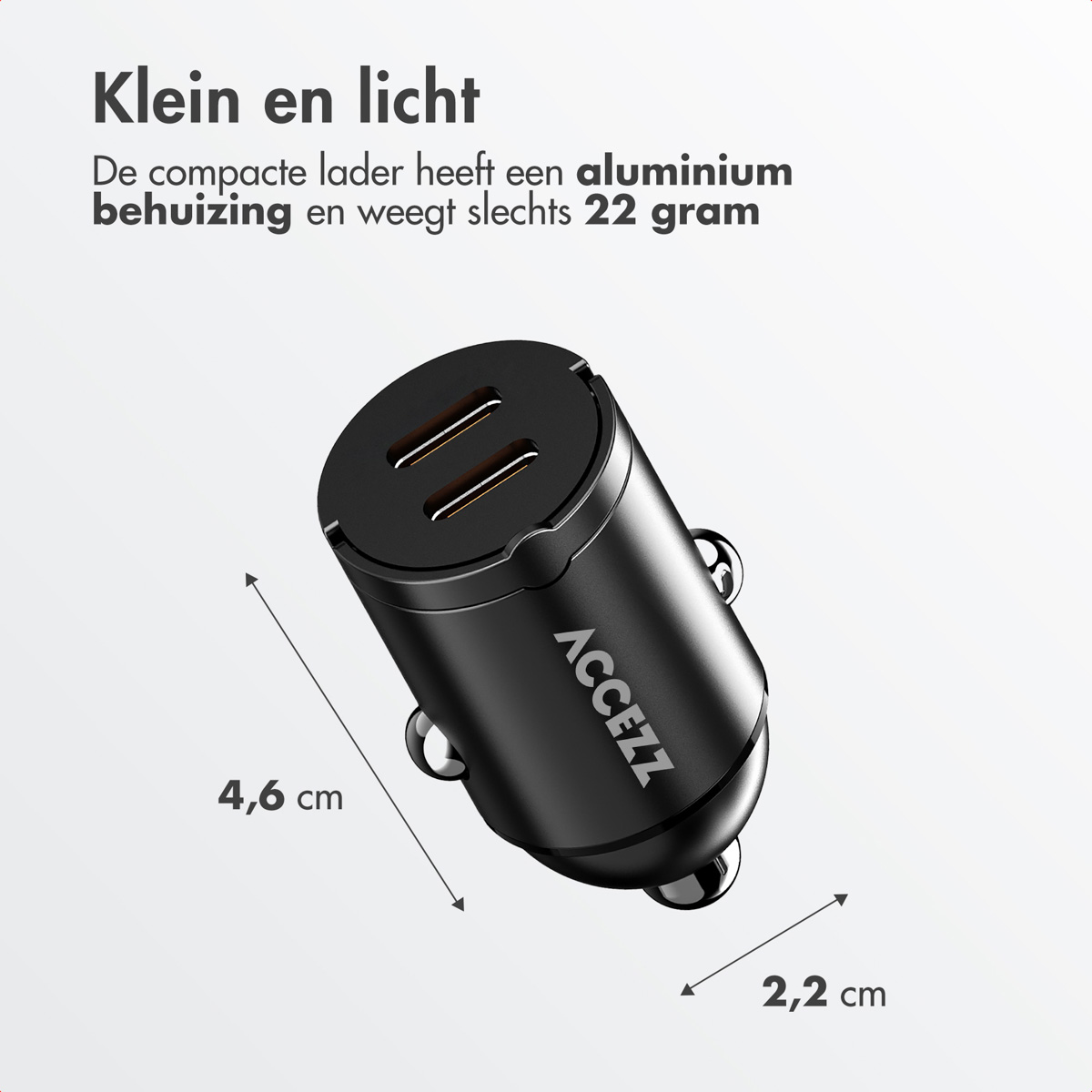 A small black car charger with two USB ports, and dimensions labeled.