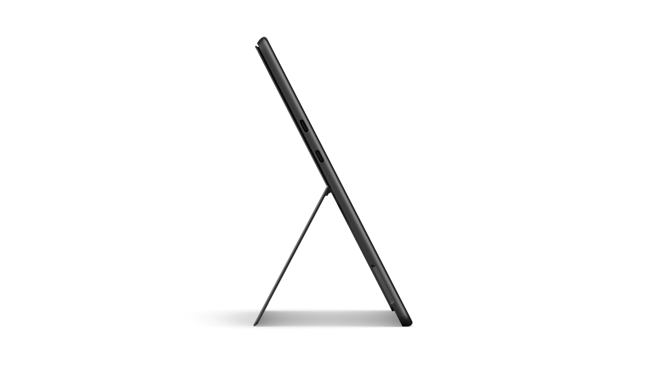 Tablet na stojaku. Tablet jest czarny, a stojak metalowy. Czarne tło.