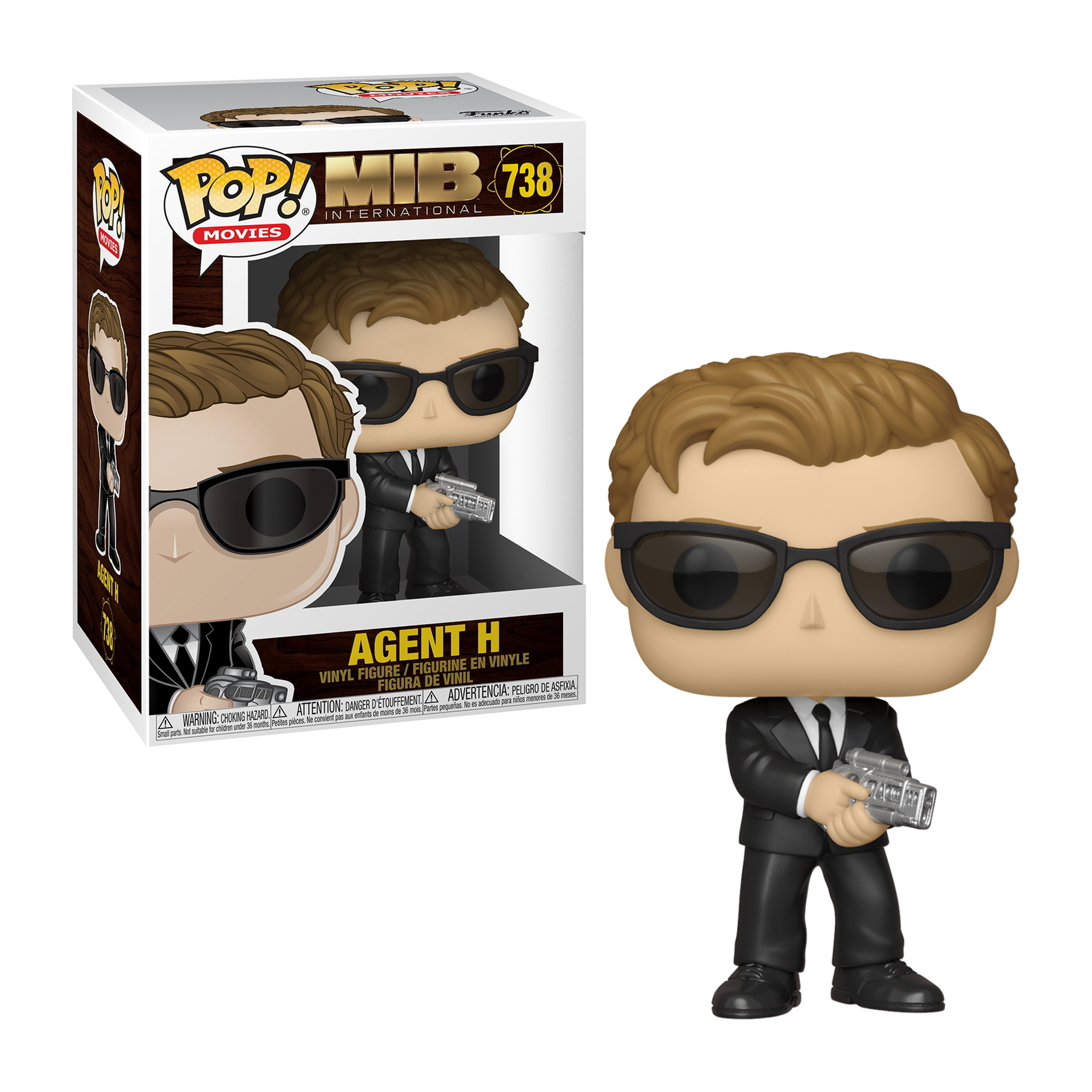 Eine Funko Pop Figur von Agent H aus Men in Black, mit der Box im Hintergrund.