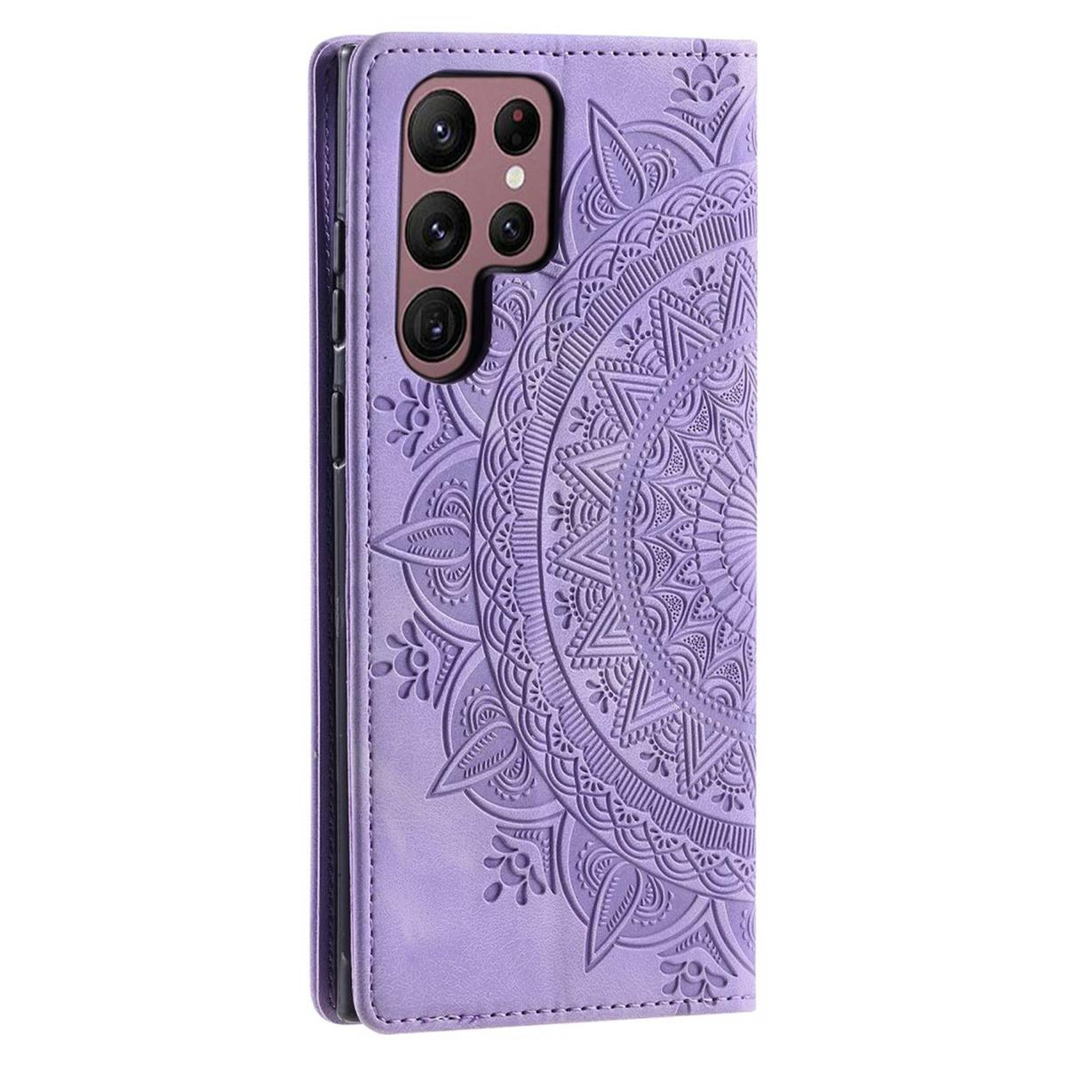 Offene lila Handyhülle mit Telefon und Mandala.