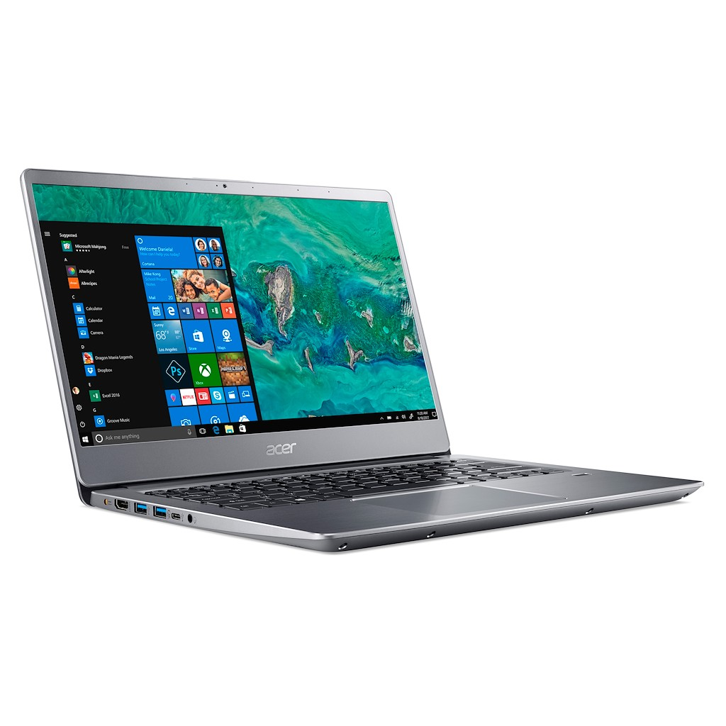 Laptop Acer argentato aperto, tastiera in vista, schermo con interfaccia Windows.