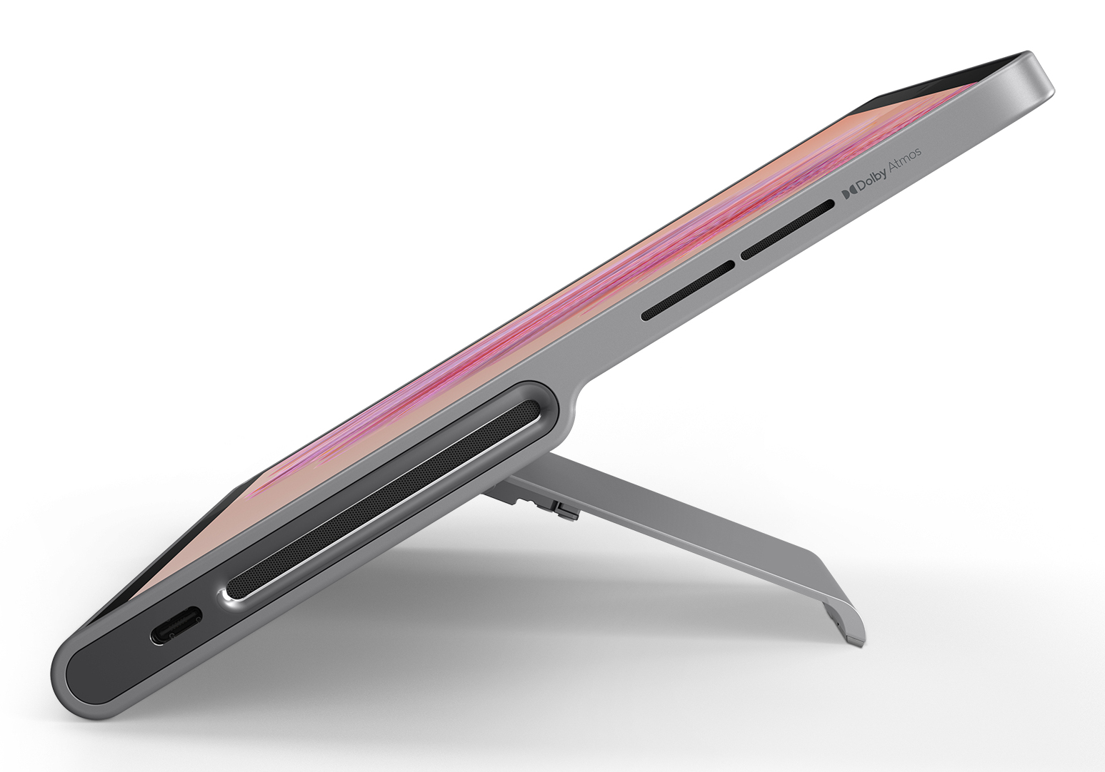 Tablet na podstawce, ustawiony pod kątem, aby pokazać ekran i bok z portami.