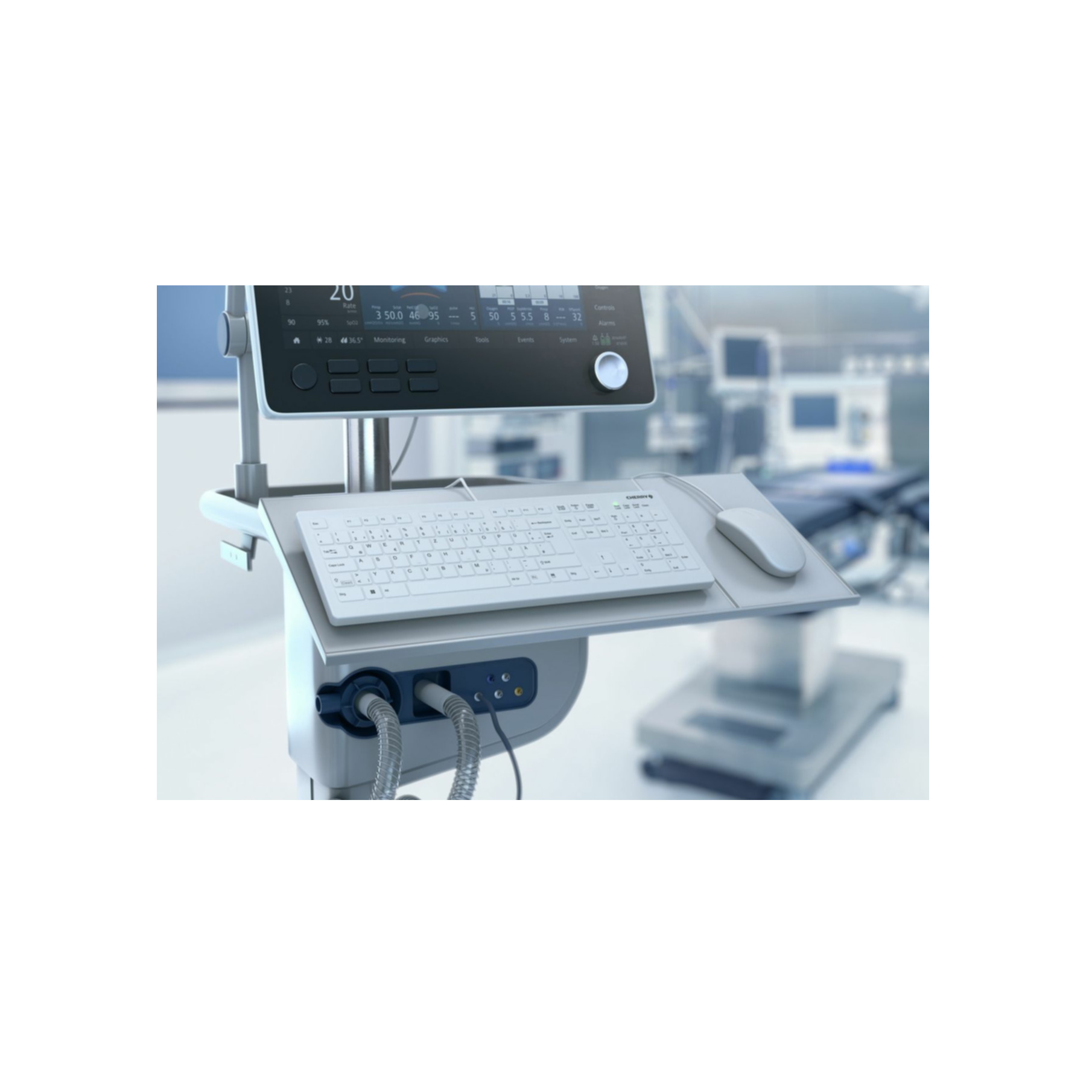 Medizinische Geräte mit Tastatur, Maus und Monitor. Der Hintergrund ist ein Operationssaal.