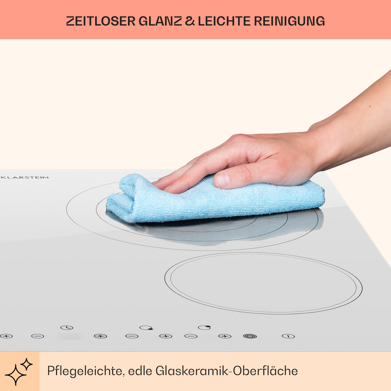 La mano di una persona che usa un panno blu per pulire un piano cottura bianco con del testo sopra.