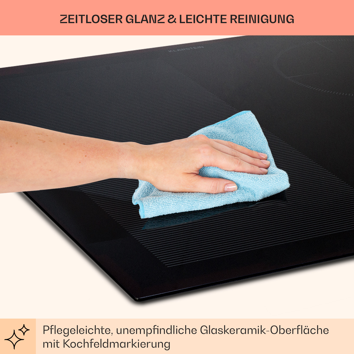 Eine Hand wischt ein schwarzes Kochfeld mit einem blauen Tuch ab. Das Kochfeld ist schwarz und sauber.