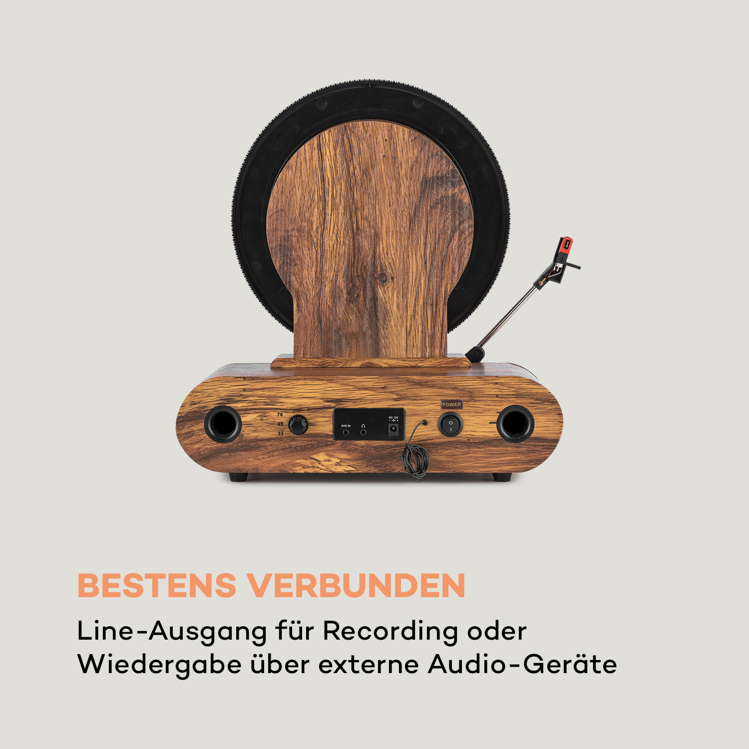 Plattenspieler aus Holz mit schwarzer Schallplatte oben und Text darunter.