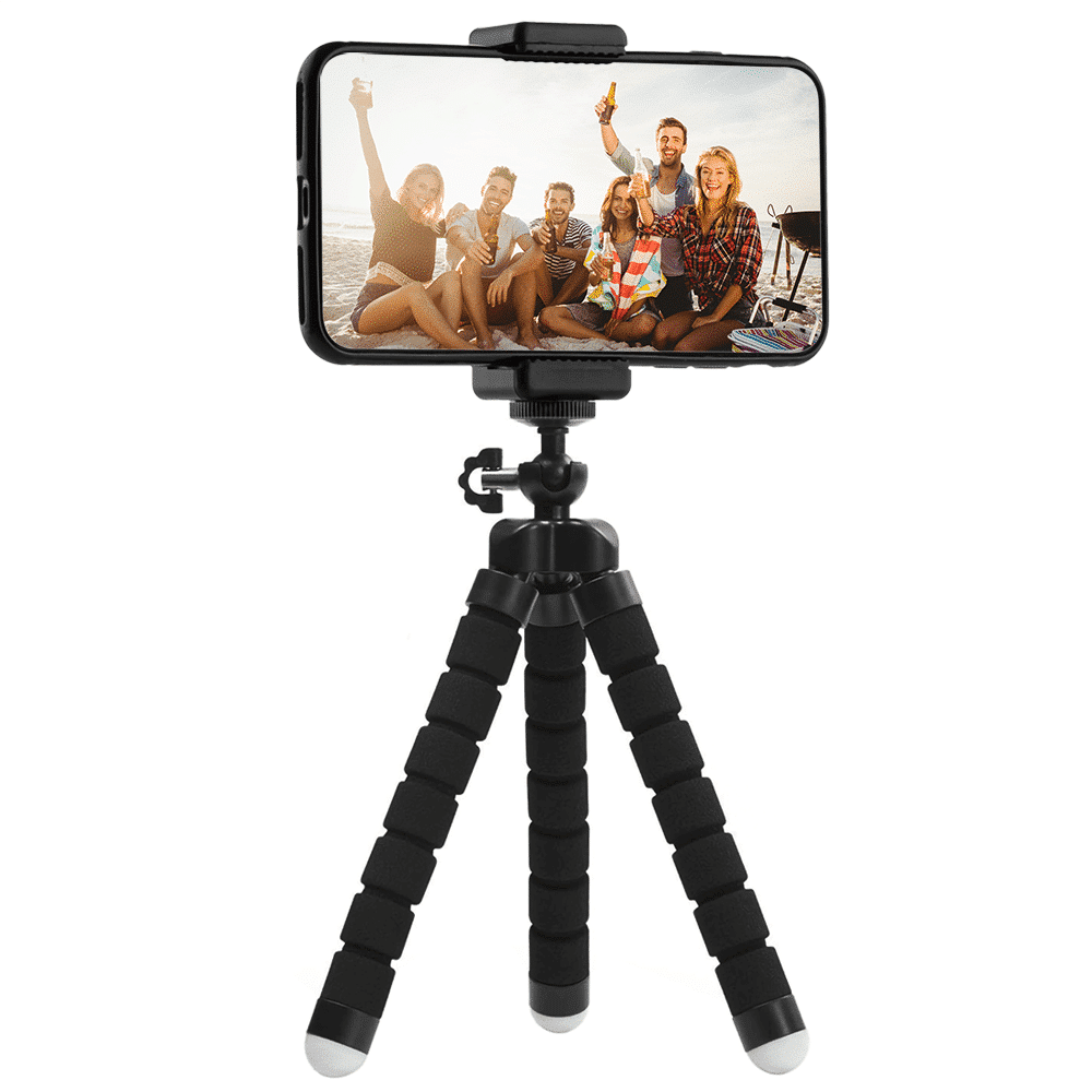 A smartphone on a tripod, displaying a photo of a group of people on the beach.