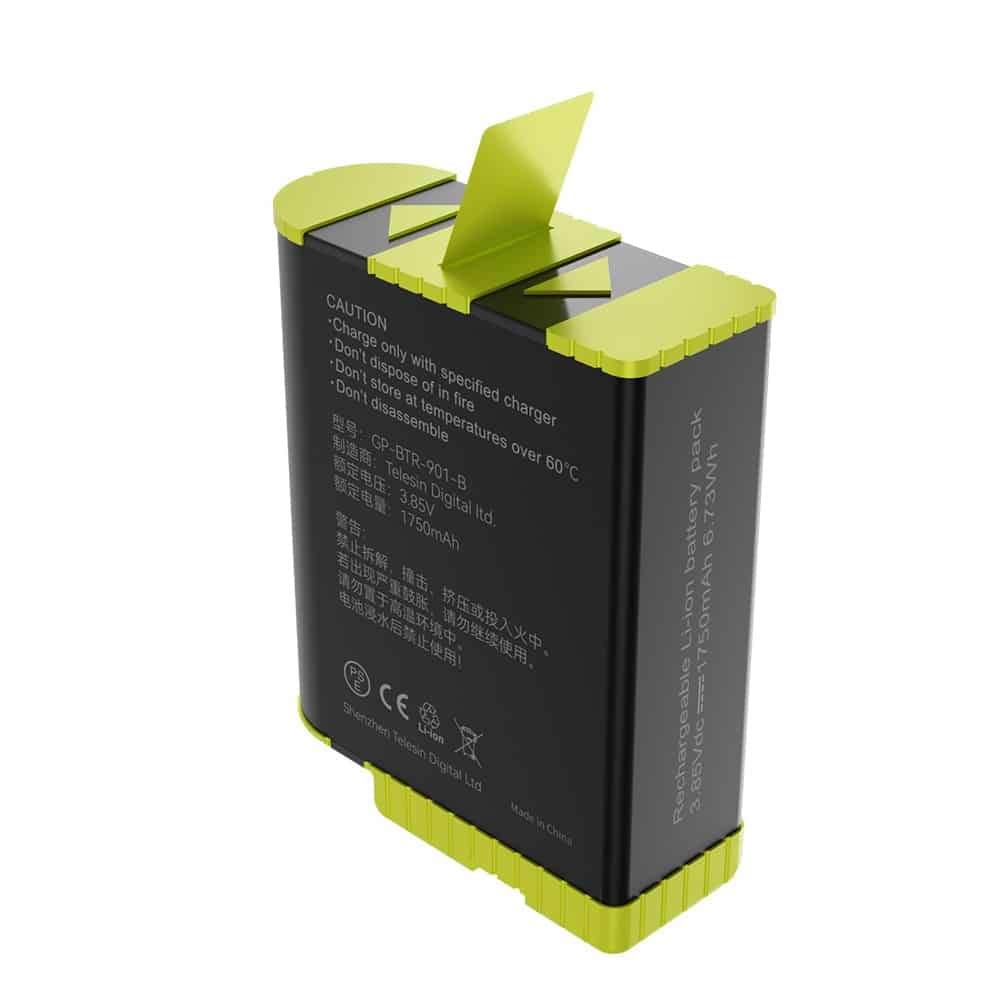 Bloc-batterie noir et vert avec avertissement.