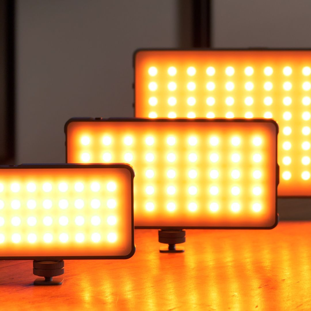 Three rectangular LED lights, glowing orange, with one in the foreground and two in the background.