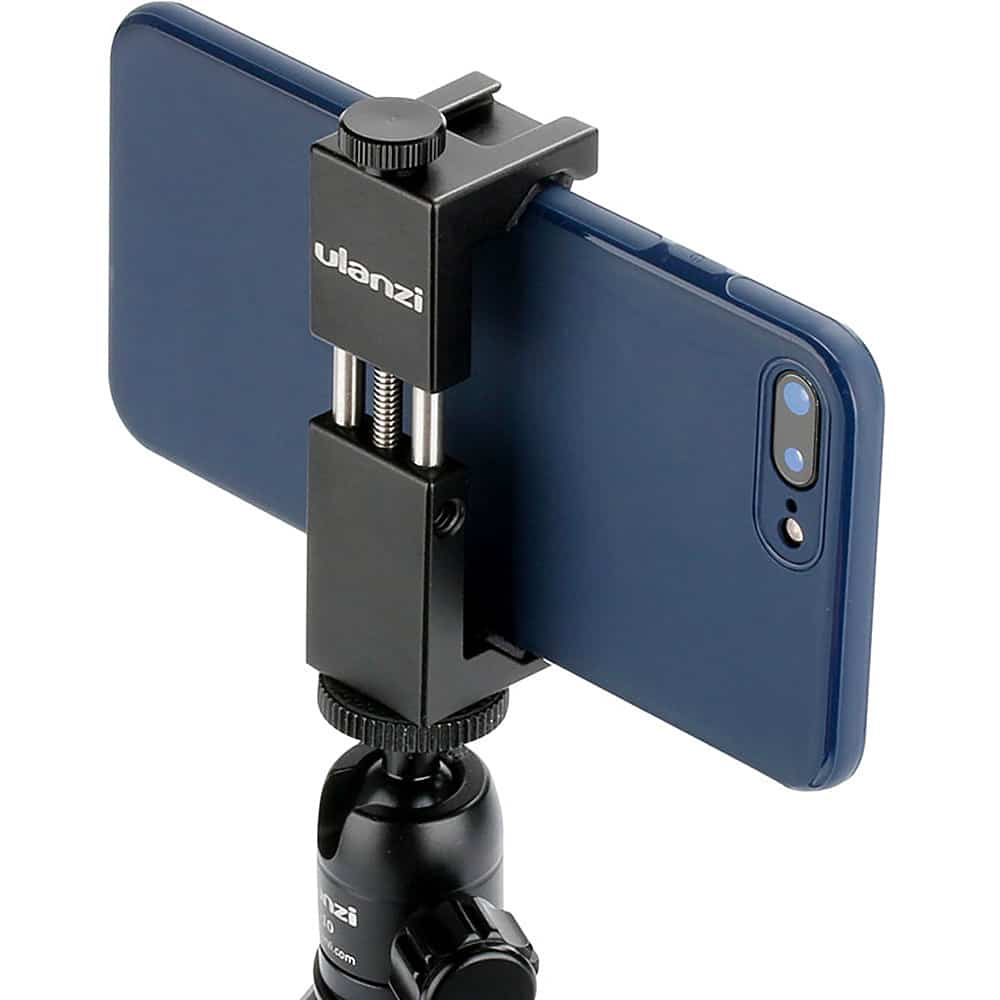 Support de téléphone noir avec téléphone bleu. Le téléphone est sur trépied noir.