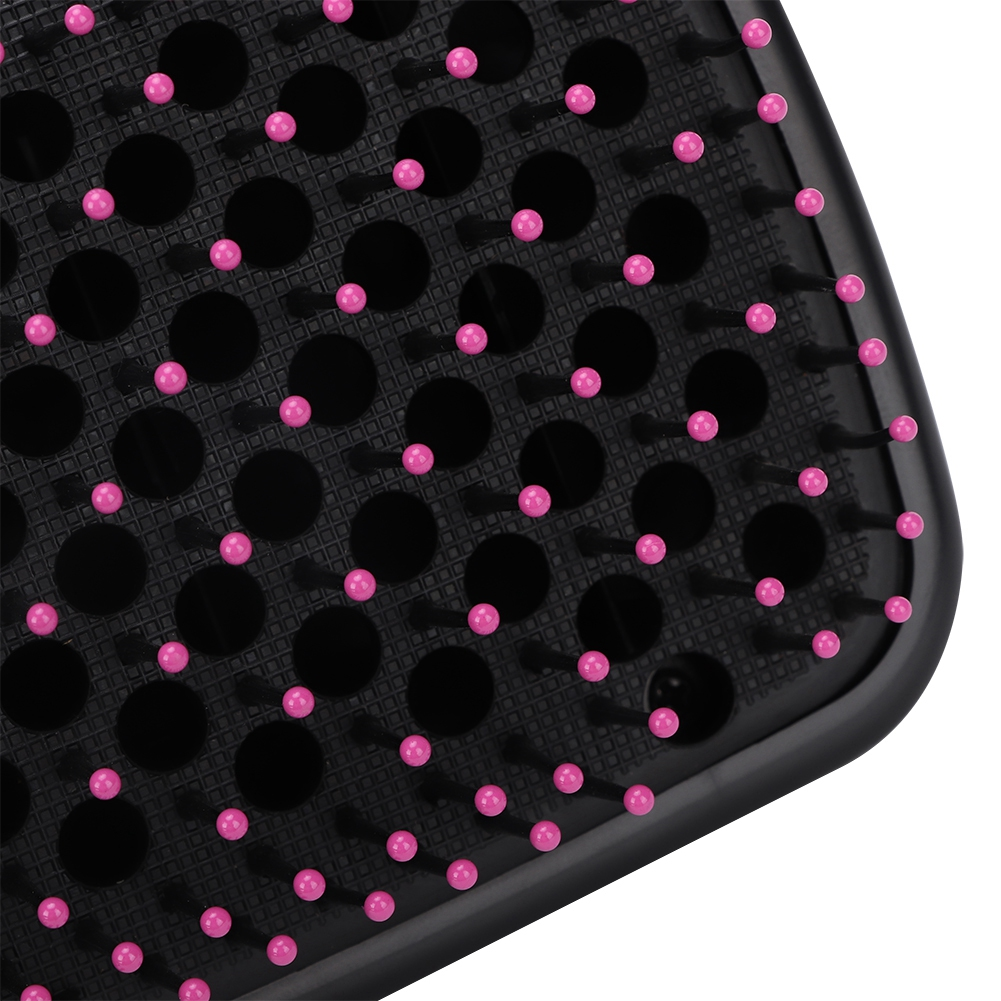Schwarze, strukturierte Gummimatte mit pinkfarbenen, abgerundeten Vorsprüngen. Weißer Hintergrund.