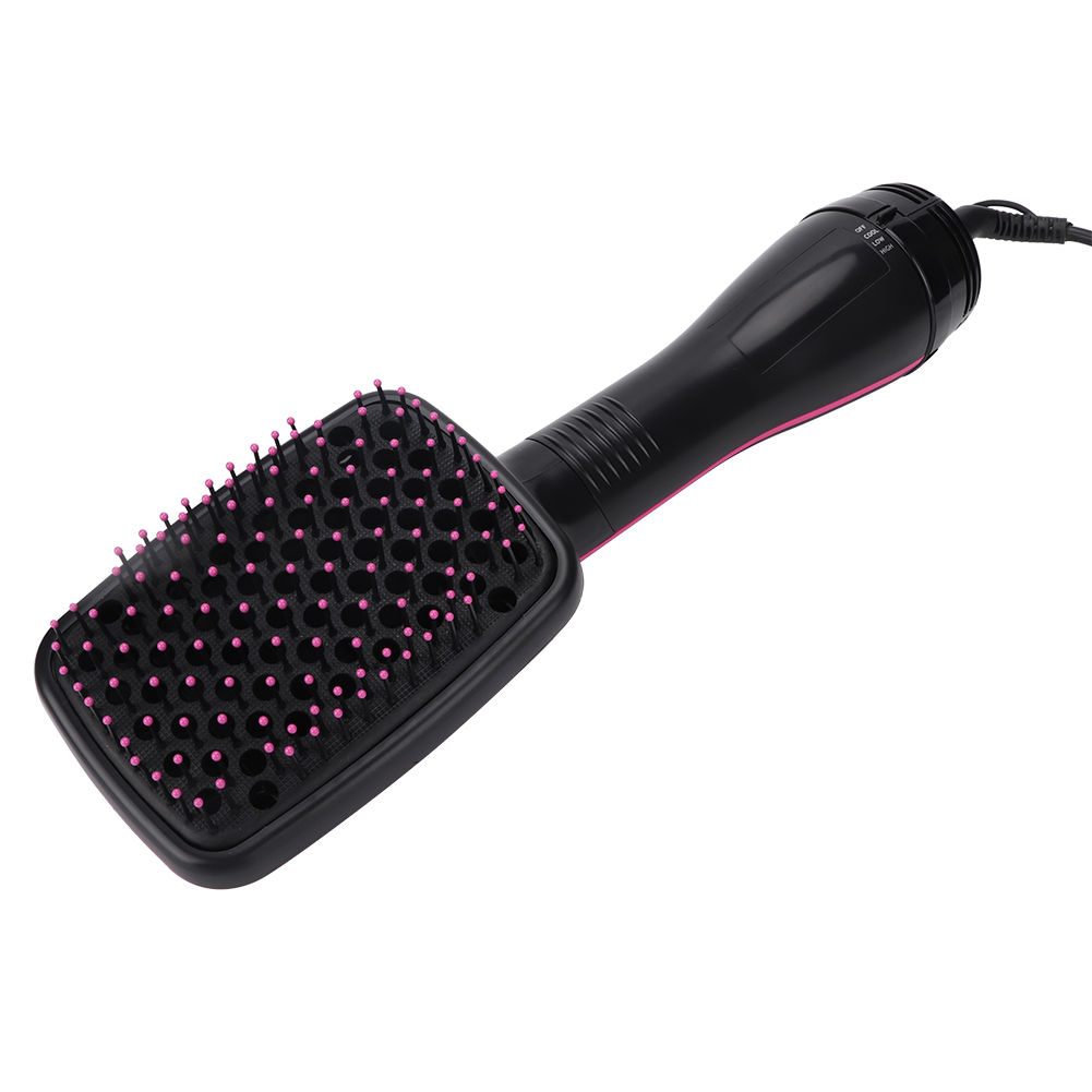 Eine schwarz-rosa Haartrocknerbürste liegt auf einer weißen Oberfläche.
