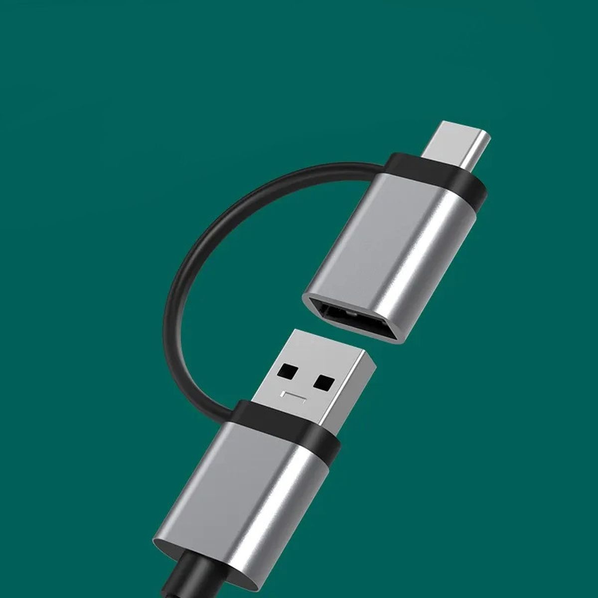 Kabel adaptera USB na USB-C ze srebrnymi złączami na tle koloru turkusowego.