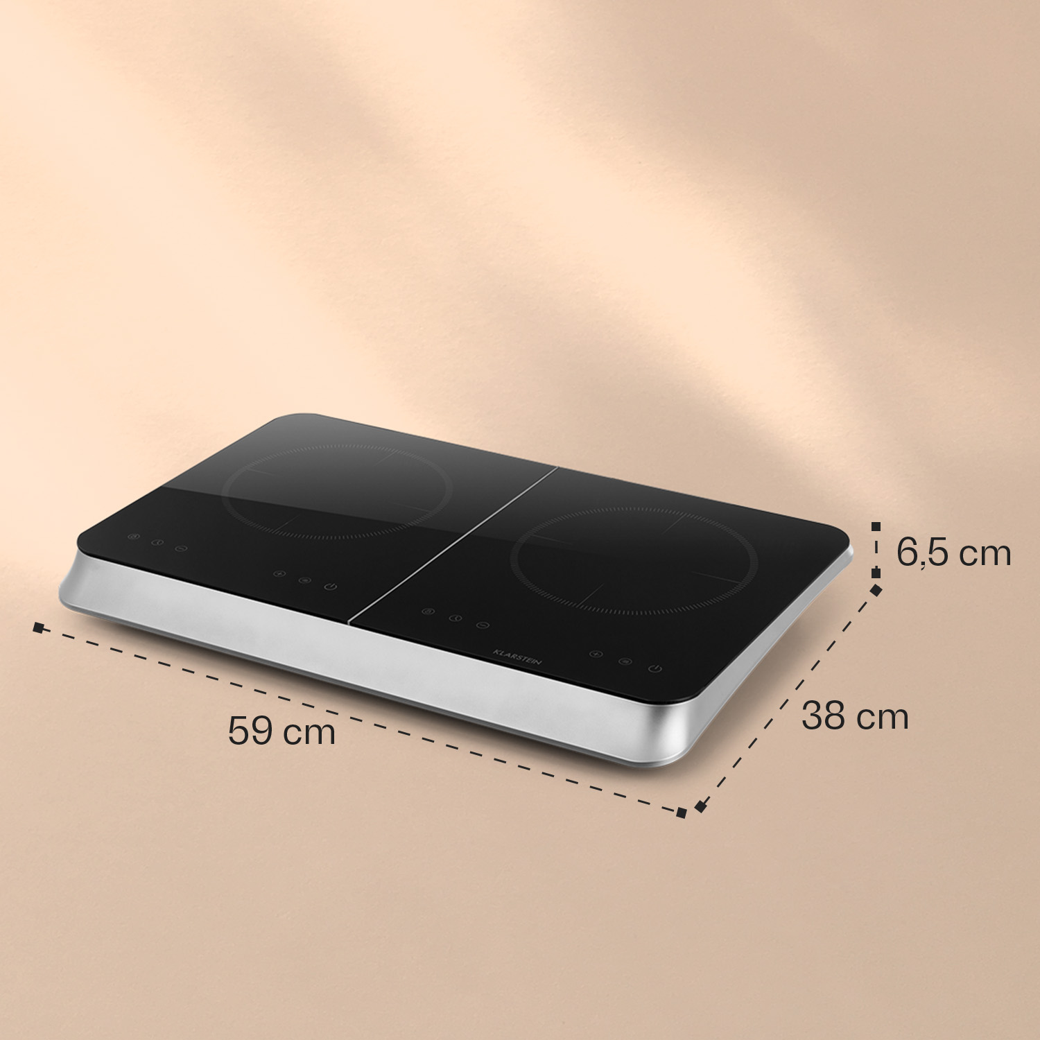 Una placa de inducción negra de dos fuegos con borde plateado y dimensiones en cm.