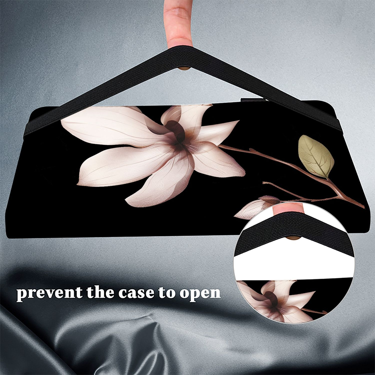 Eine schwarze Hülle mit Blumendesign. Ein Finger hält einen Riemen. Der Text lautet 'verhindern, dass sich die Hülle öffnet'.