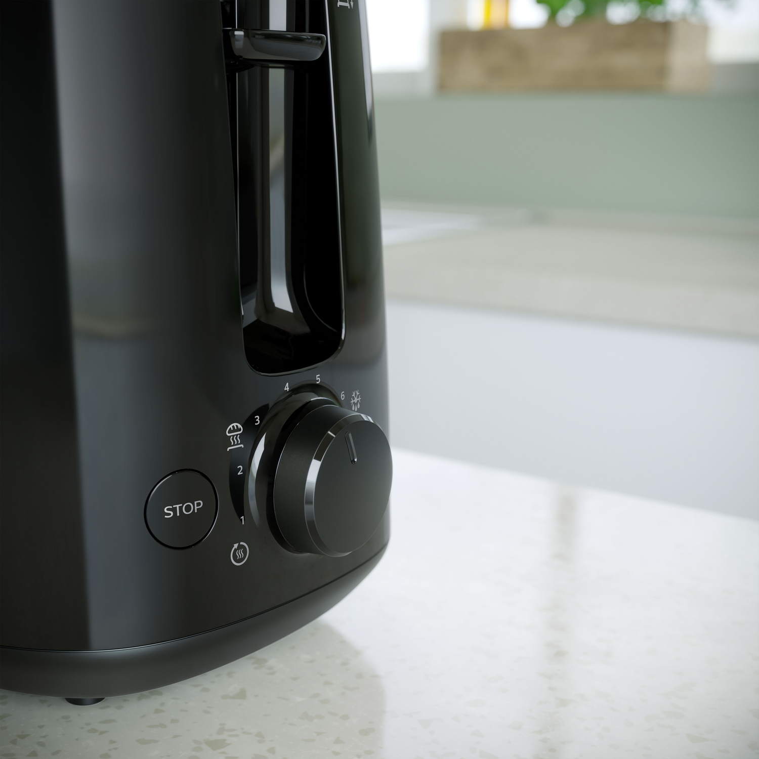 Zbliżenie czarnego tostera, pokazujące elementy sterowania, na białym blacie.