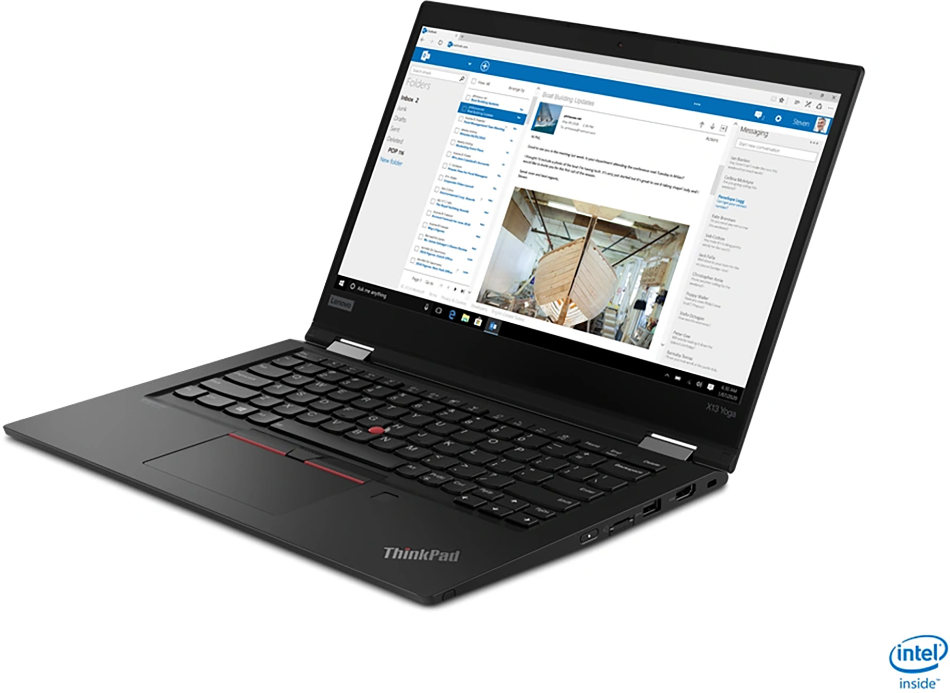 A black laptop open on a table. The screen displays a website.
