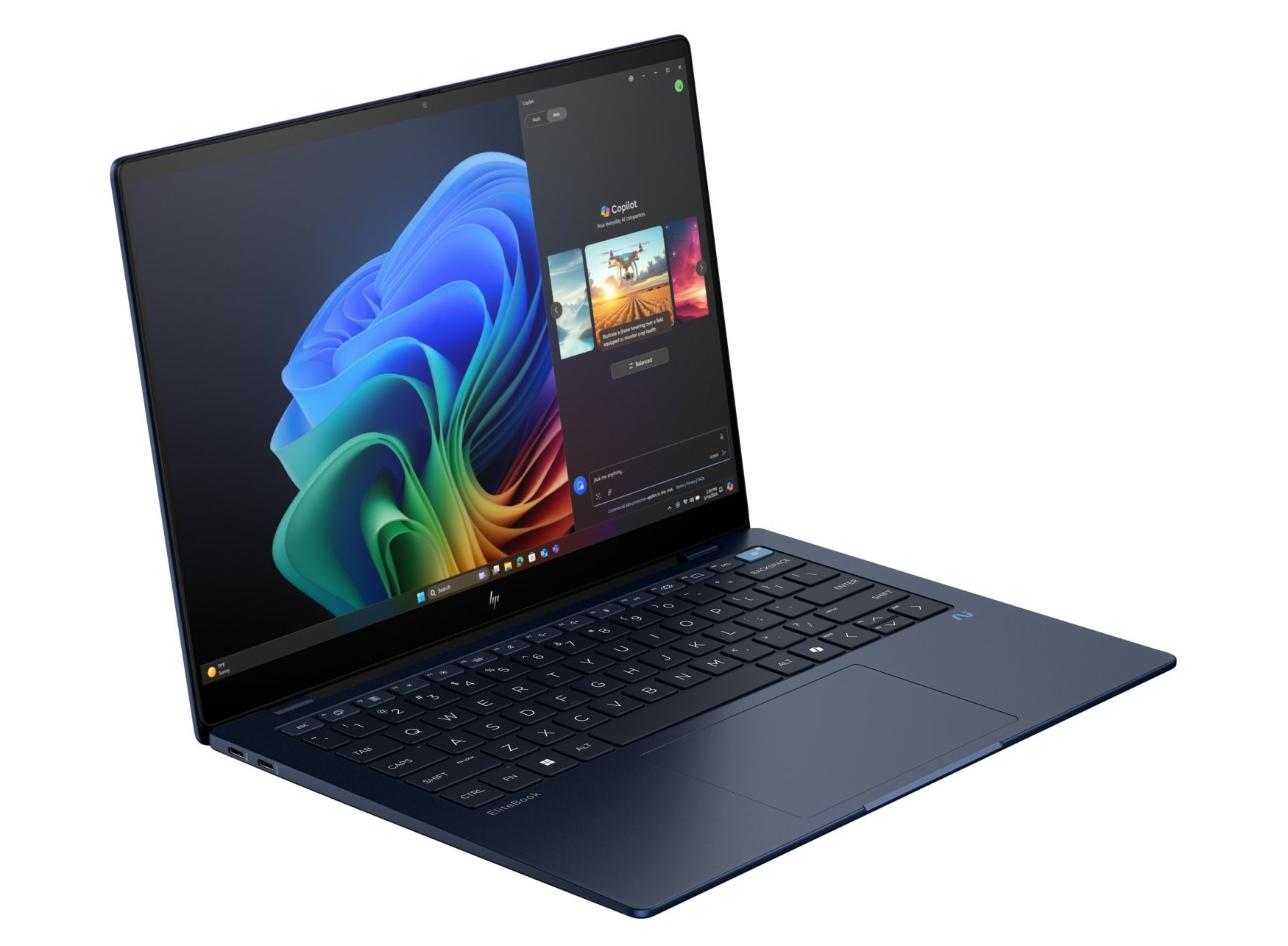 Un computer portatile blu con tastiera nera e uno schermo che mostra un'interfaccia software.