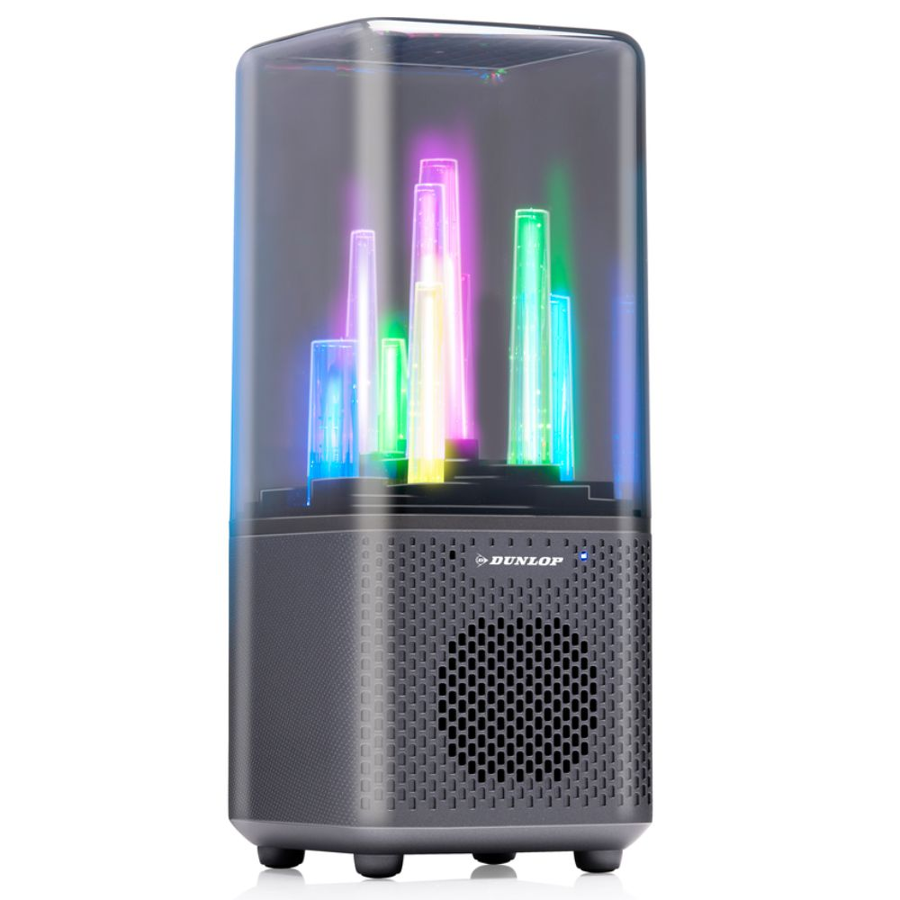 Een speaker met kleurrijke lichtkolommen in een transparante behuizing. De speaker is donkergrijs met een gaasfront.