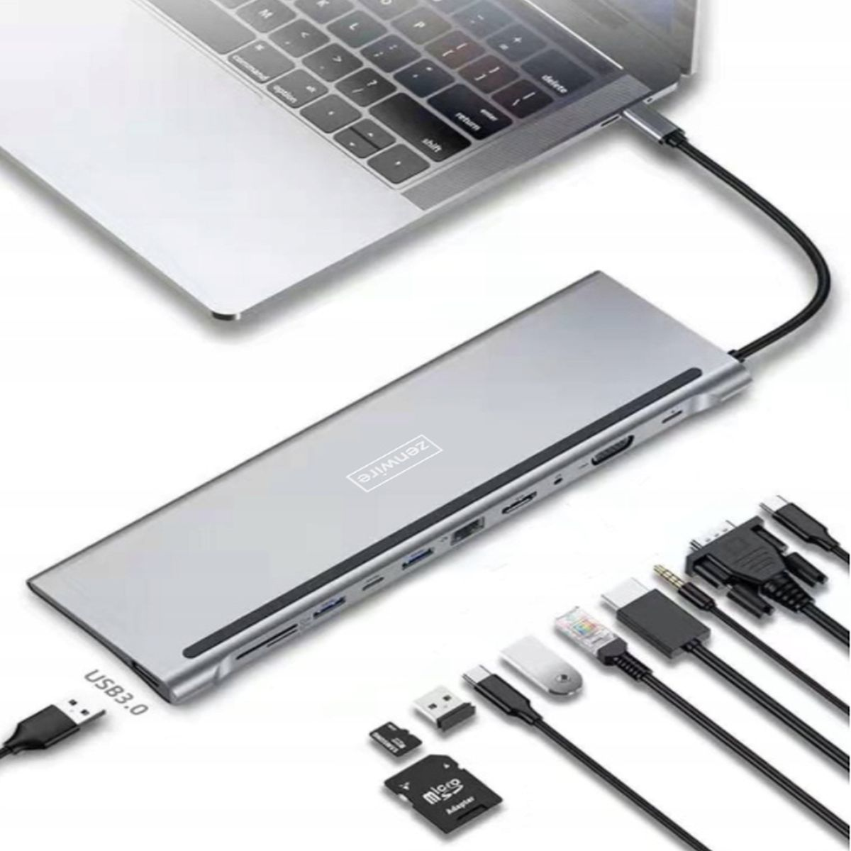 Srebrny hub USB-C podłączony do laptopa, z różnymi portami i kablami.