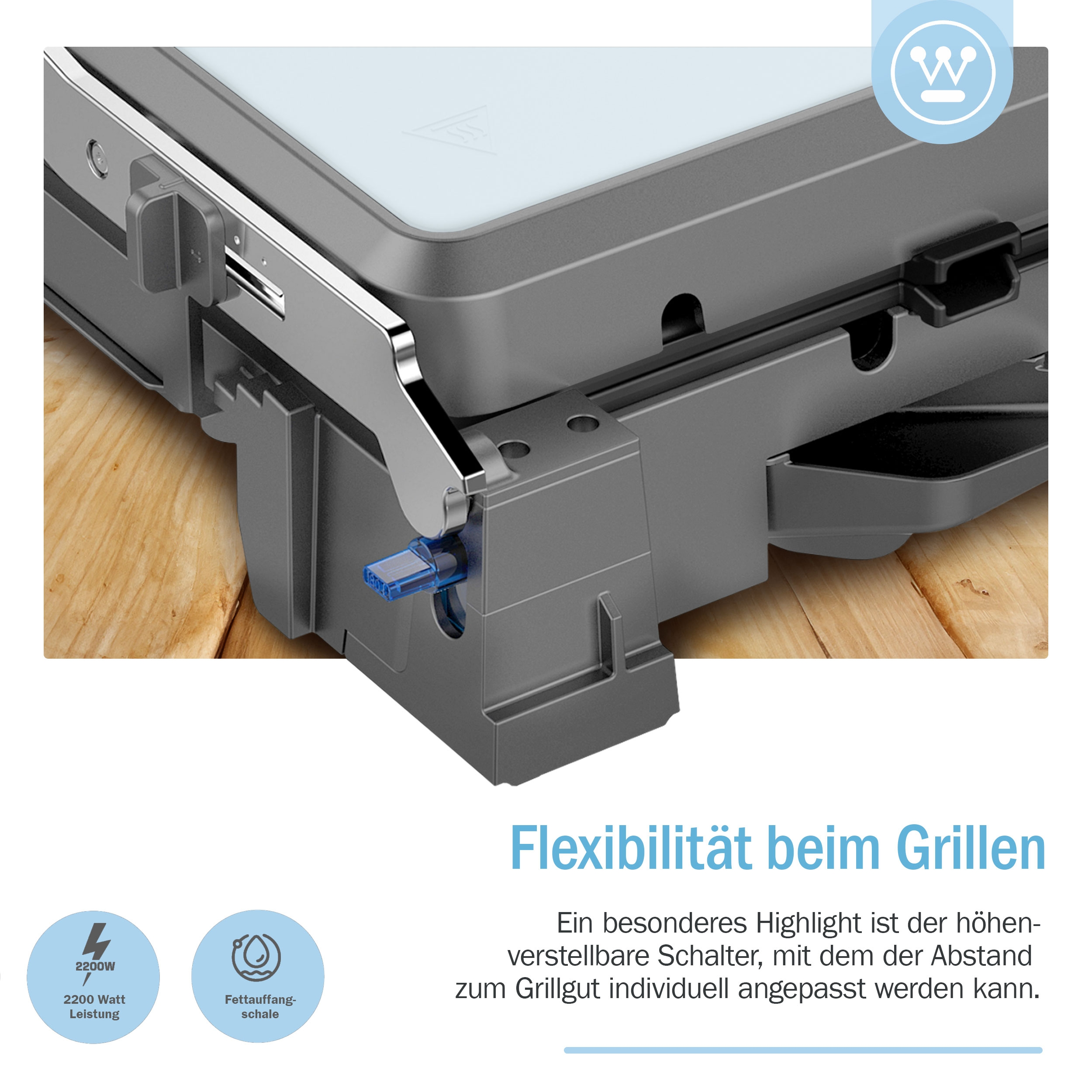 Grauer Grill mit blauem Knopf. Schwarzer Text darunter. Holzoberfläche.