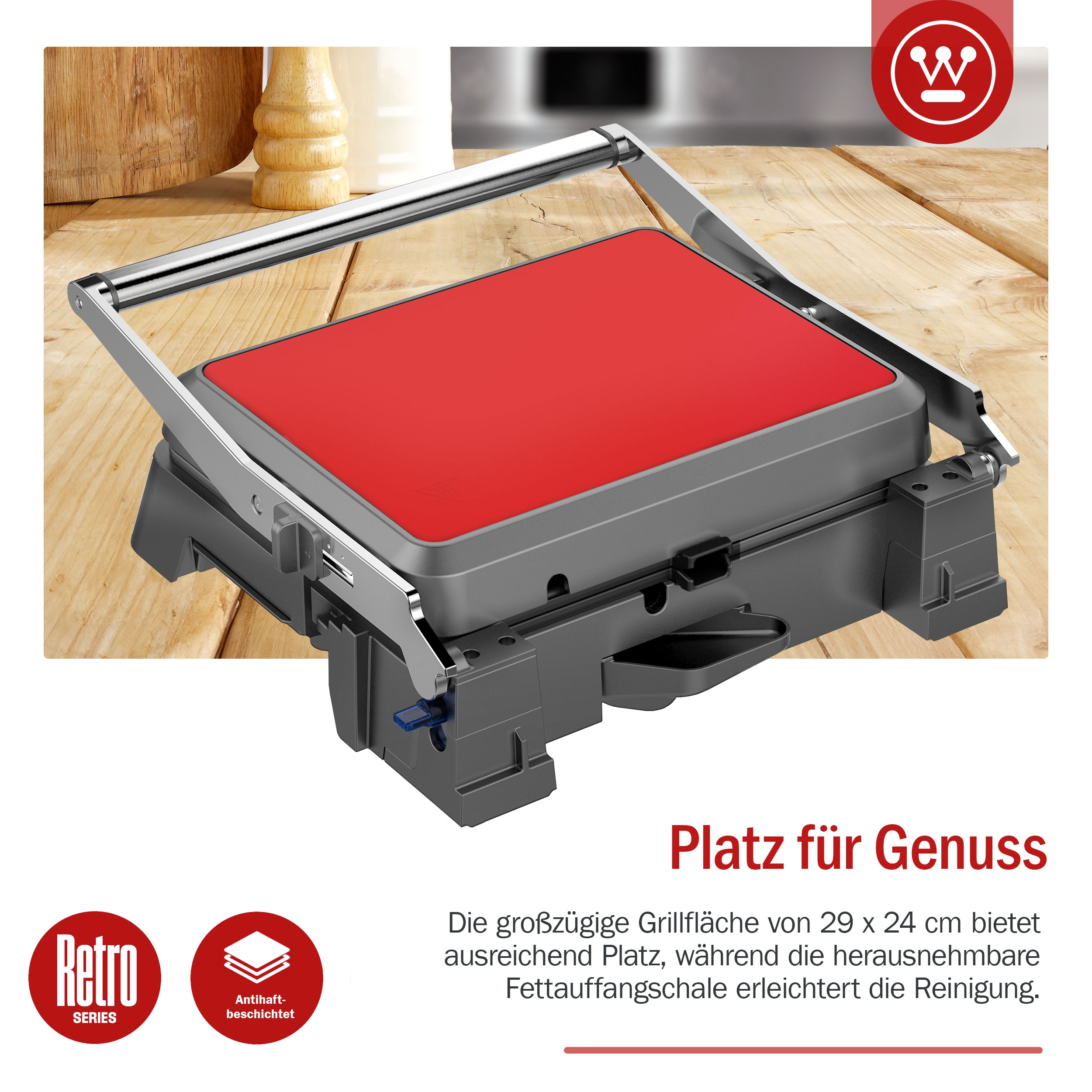 Roter und grauer Grill mit silbernem Griff.