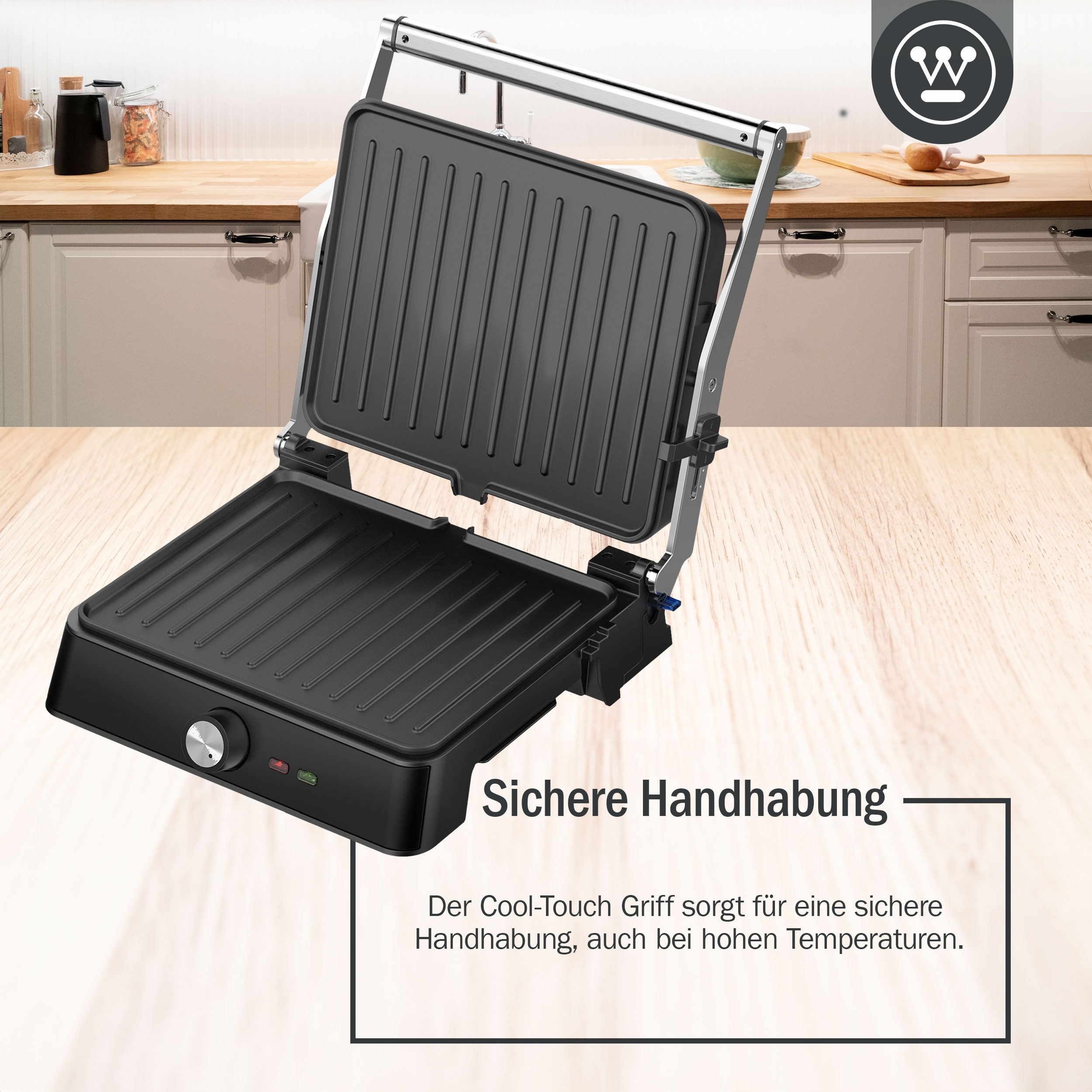 Ein schwarzer Grill mit offenem Deckel. Der Text 'Sichere Handhabung' wird darunter angezeigt.