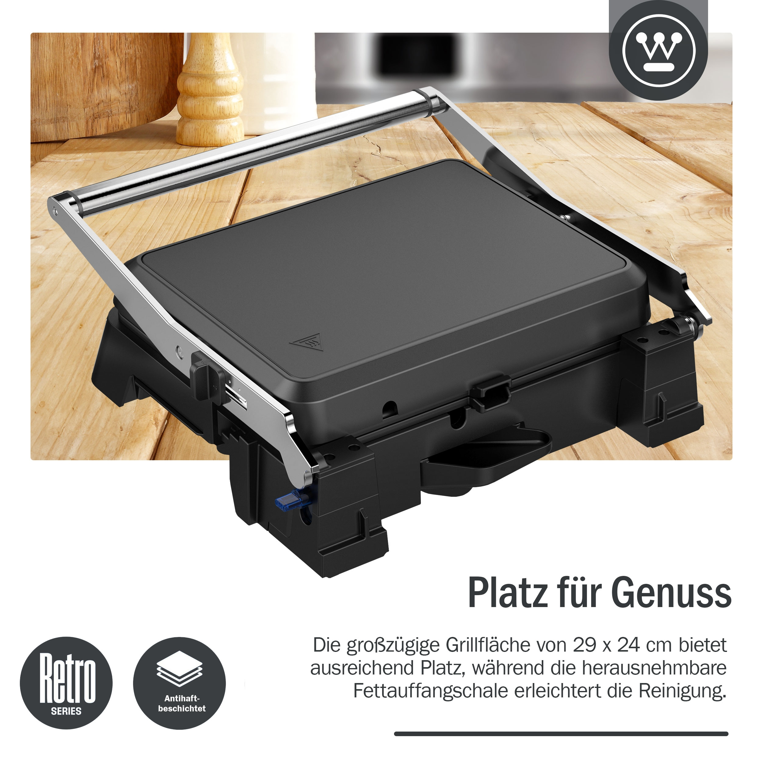 Schwarzer Grill auf Holzoberfläche mit deutschem Text.
