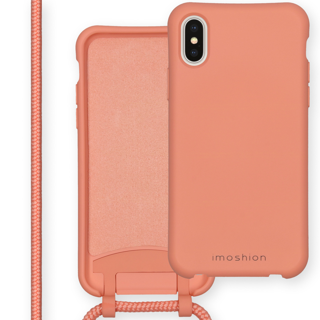 Une coque de téléphone couleur pêche avec une sangle.